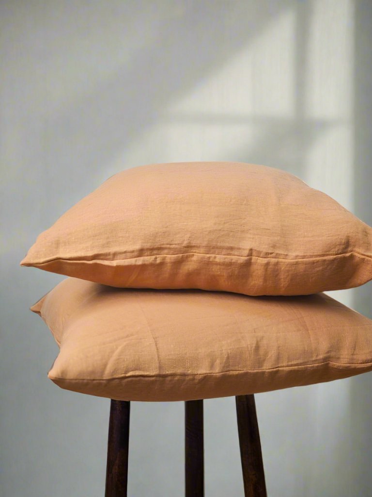 Two Linen Cushion Cover in Terracotta - TSL, throw pillows on a stool 