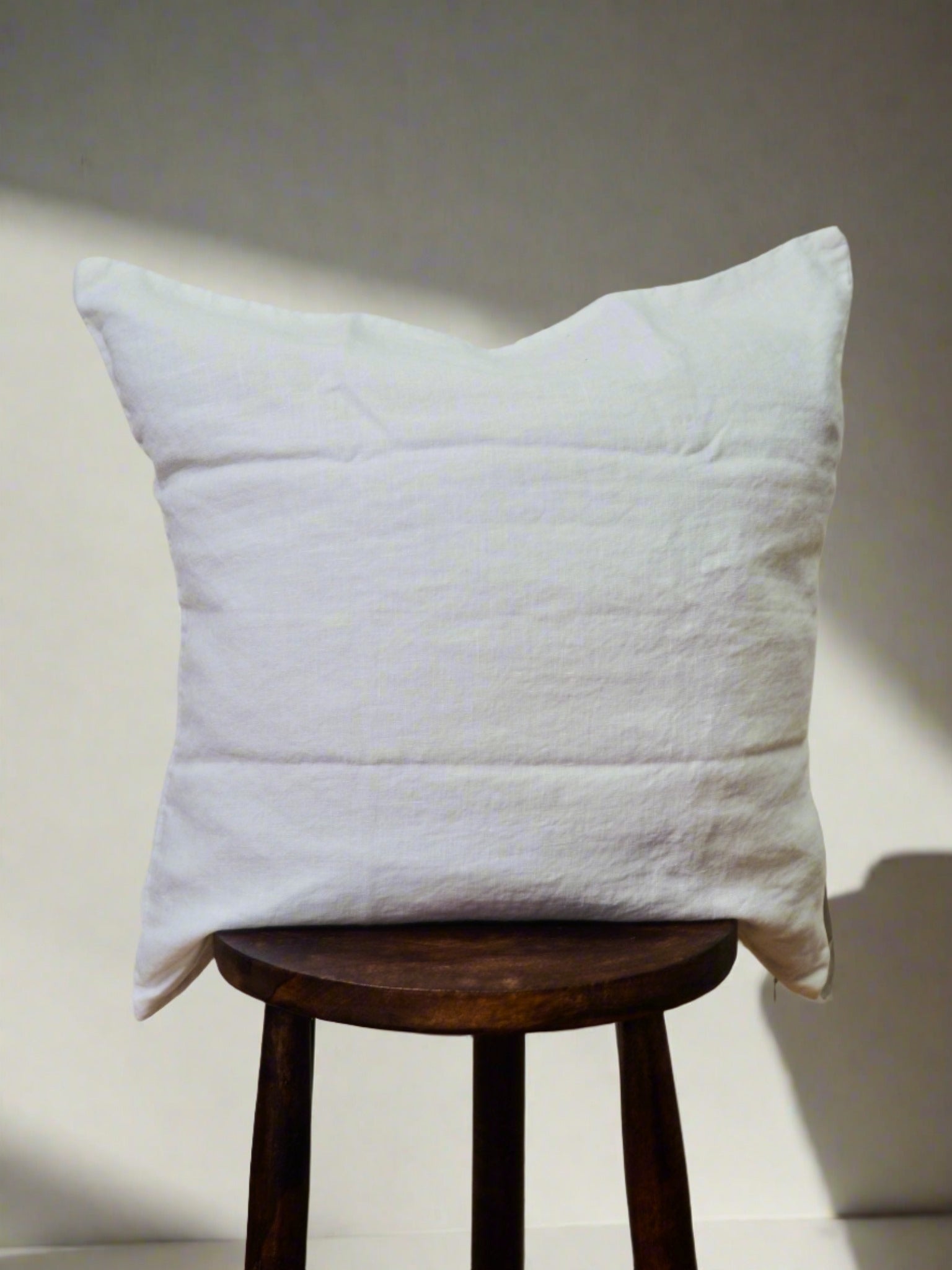 Linen Cushion Cover in White - TSL, cushion case on a stool 